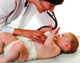 Doctor examining baby